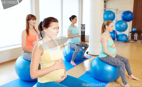 Image of pregnant women sitting on exercise balls in gym