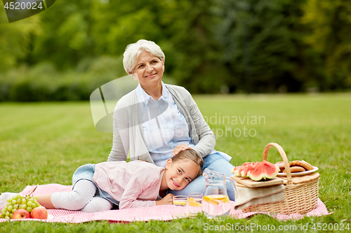 Image of grandmother and granddaughter at picnic in park