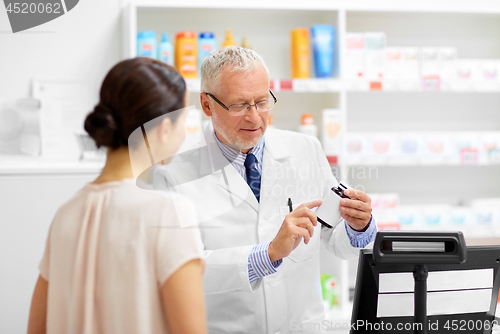 Image of apothecary with cure and customer at pharmacy