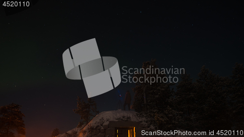 Image of Man shooting northern lights