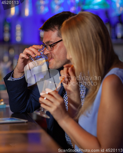 Image of Young people drinking in the bar