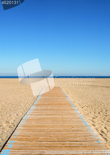 Image of Empty beach and wooden path