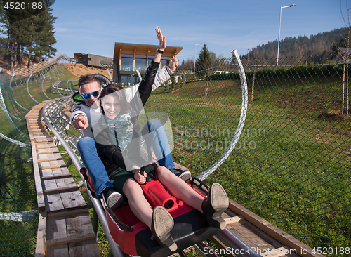 Image of couple enjoys driving on alpine coaster