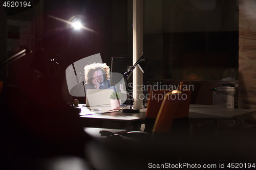 Image of businessman relaxing at the desk