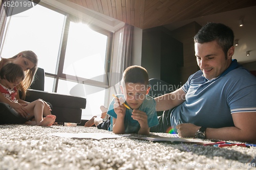 Image of young couple spending time with kids