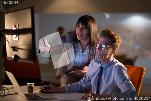 Image of young designers in the night office