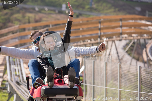 Image of couple enjoys driving on alpine coaster