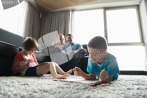 Image of young couple spending time with kids