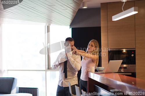 Image of A young couple is preparing for a job and using a laptop