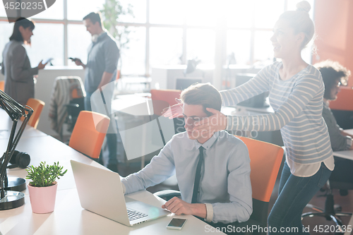 Image of Two Business People Working With laptop in office