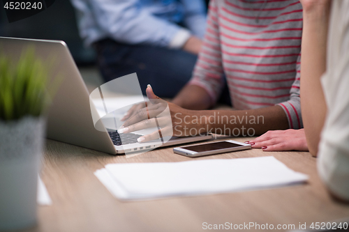 Image of Multiethnic startup business team in night office