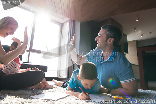 Image of young couple spending time with kids