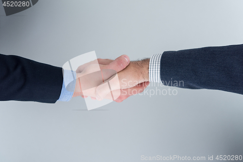 Image of cloasing the deal in modern office interior top view