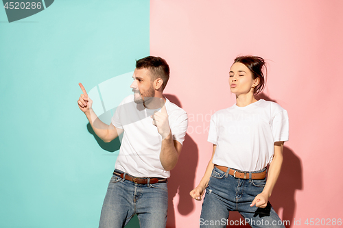 Image of A couple of young man and woman dancing hip-hop at studio.