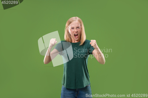 Image of A portrait of surprised screaming woman