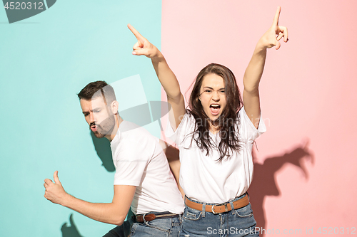 Image of A couple of young man and woman dancing hip-hop at studio.