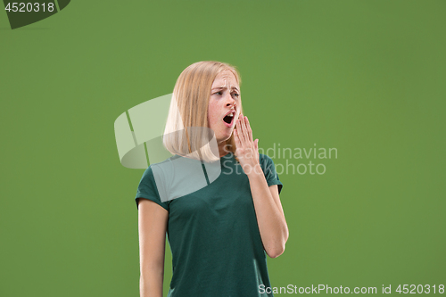 Image of Beautiful bored woman bored isolated on green background