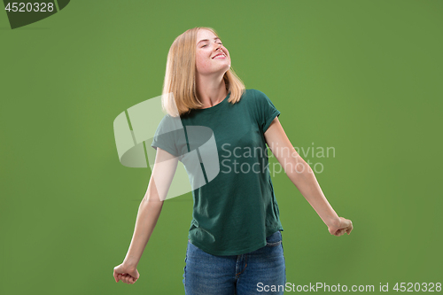 Image of happy woman. image of female model on green