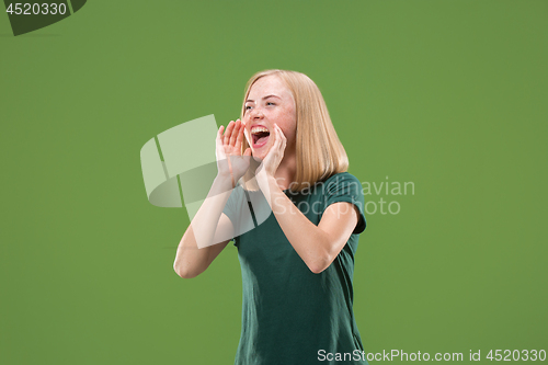 Image of A portrait of surprised screaming woman