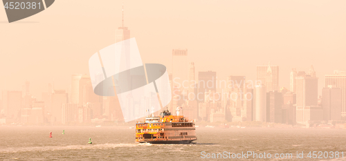 Image of Staten Island Ferry and Lower Manhattan Skyline, New York, USA.