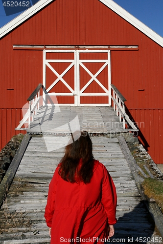 Image of Woman in front of a barn bridge