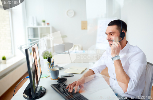 Image of businessman having video call on pc at office