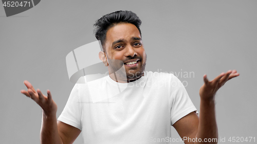 Image of confused indian man shrugging