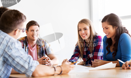 Image of group of smiling students meeting at school