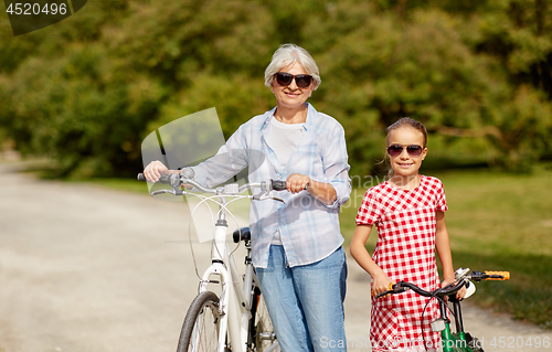 Image of grandmother and granddaughter with bicycles