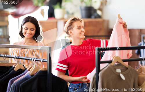 Image of women choosing clothes at vintage clothing store