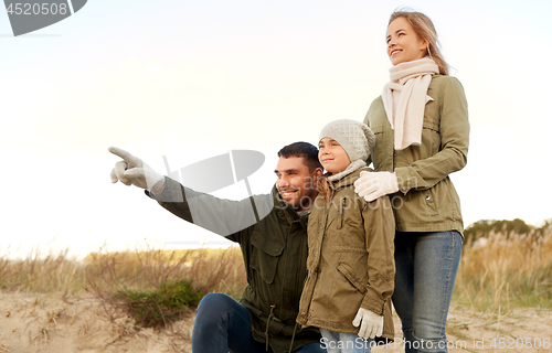 Image of happy family on autumn beach