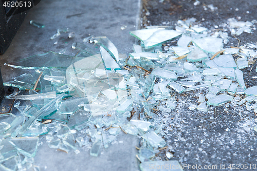 Image of shards of broken glass on floor