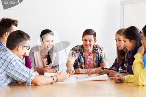 Image of group of smiling students meeting at school