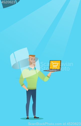 Image of Man holding laptop with trolley on a screen.