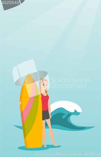 Image of Young caucasian surfer holding a surfboard.