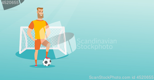 Image of Young caucasian football player with a ball.