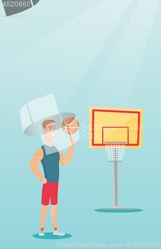 Image of Young caucasian basketball player spinning a ball.
