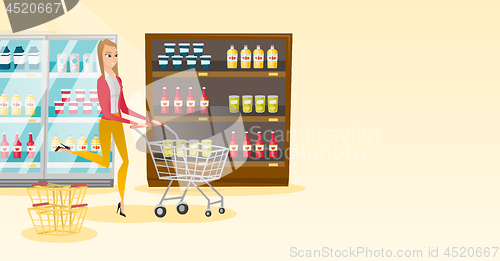 Image of Caucasian woman running with trolley in the store.