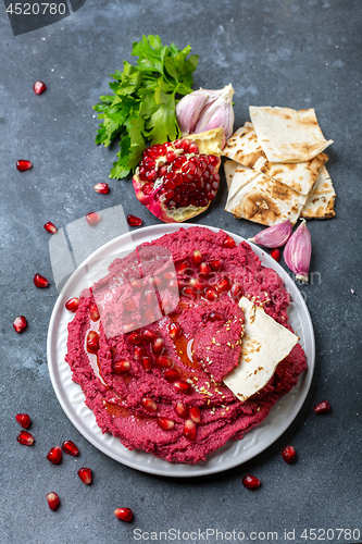 Image of Homemade traditional beetroot hummus.