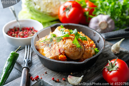 Image of Cabbage rolls with minced meat and tomato sauce.