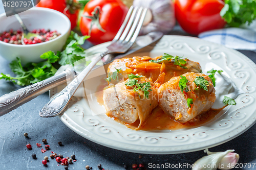 Image of Cabbage rolls with minced meat and sour cream.