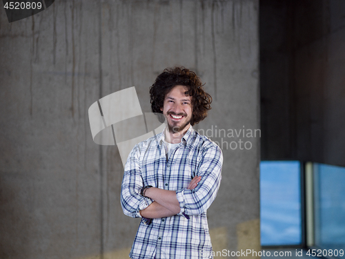 Image of portrait of young male architect on construction site