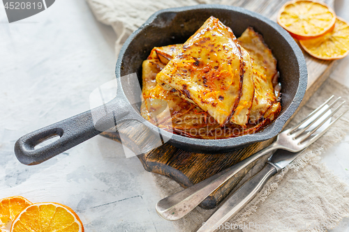 Image of Crepe Suzette with orange sauce.