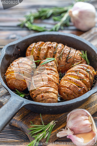 Image of Potatoes baked with garlic and rosemary.