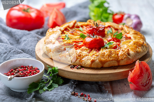 Image of Homemade open pie (Galette) with potatoes.