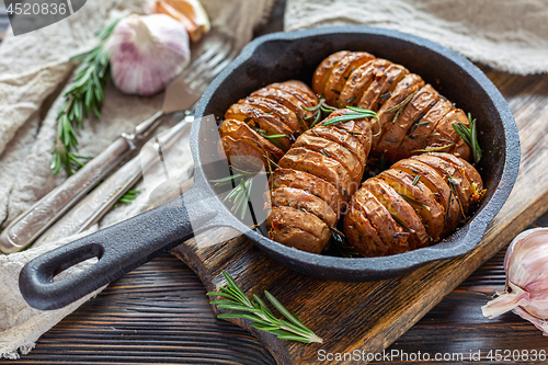 Image of Frying pan with roasted potatoes and rosemary.