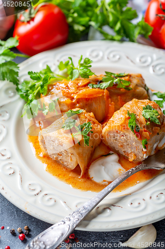 Image of Cabbage rolls stuffed with ground beef and rice.