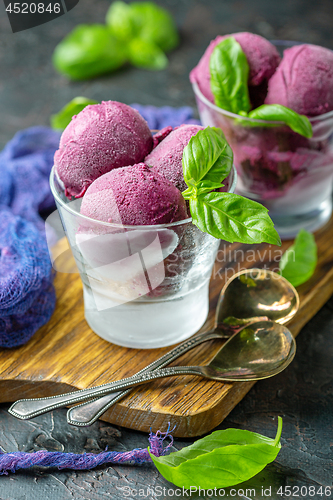 Image of Blueberry ice cream with basil in glasses.