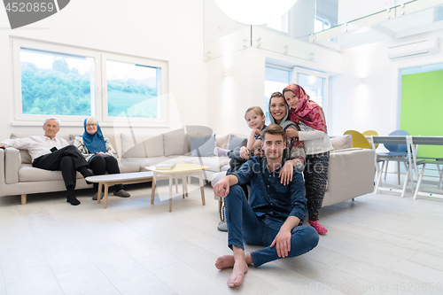 Image of portrait of happy modern muslim family