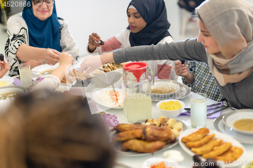 Image of modern multiethnic muslim family having a Ramadan feast